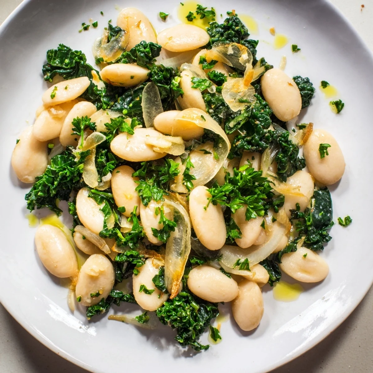 Enjoy a visual of golden garlic-infused Garlicky Beans with Winter Greens, perfectly plated.