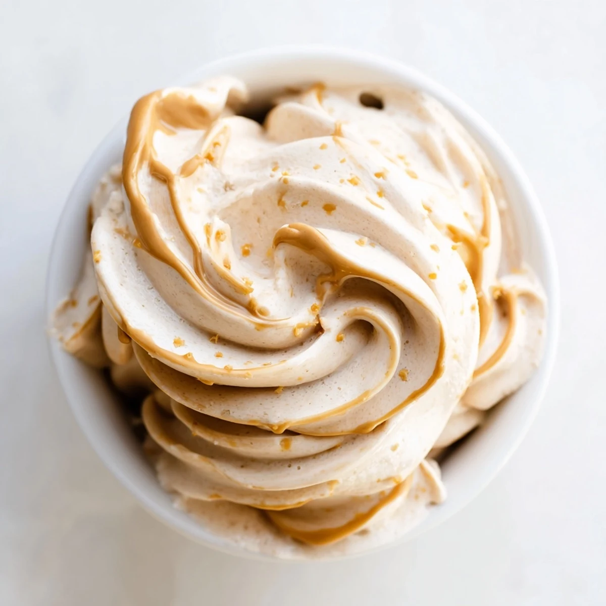 Smooth and creamy Peanut Butter Banana Ice Cream, a dairy-free dessert, ready to enjoy with a spoon.