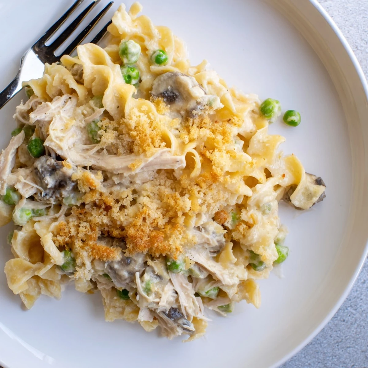 Golden, bubbly Creamy Tuna Noodle Casserole with a crispy Ritz cracker topping, ready to serve and enjoy.