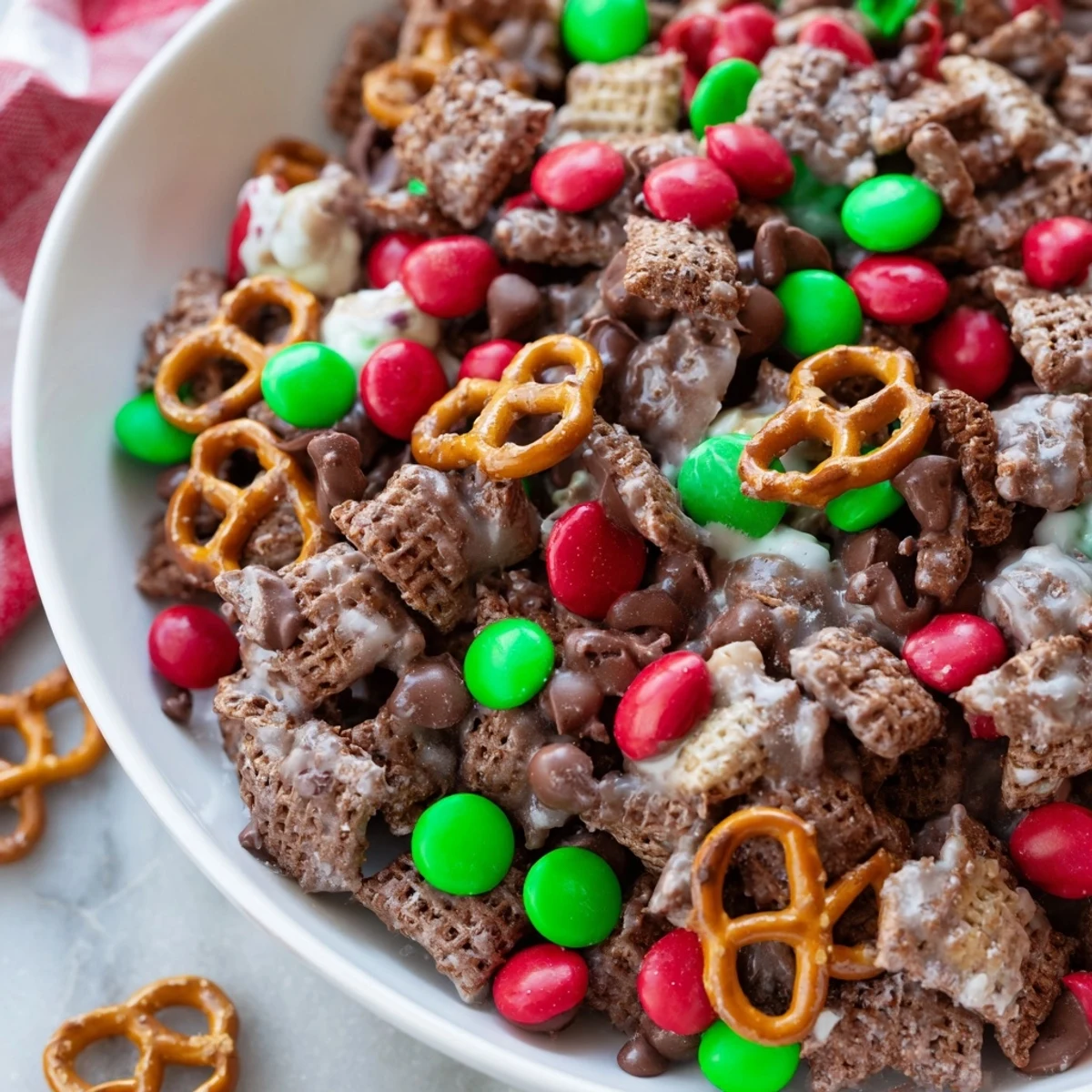 This festive batch of Simplified Reindeer Chow shows off the chocolatey, peanut butter goodness, ready to eat.