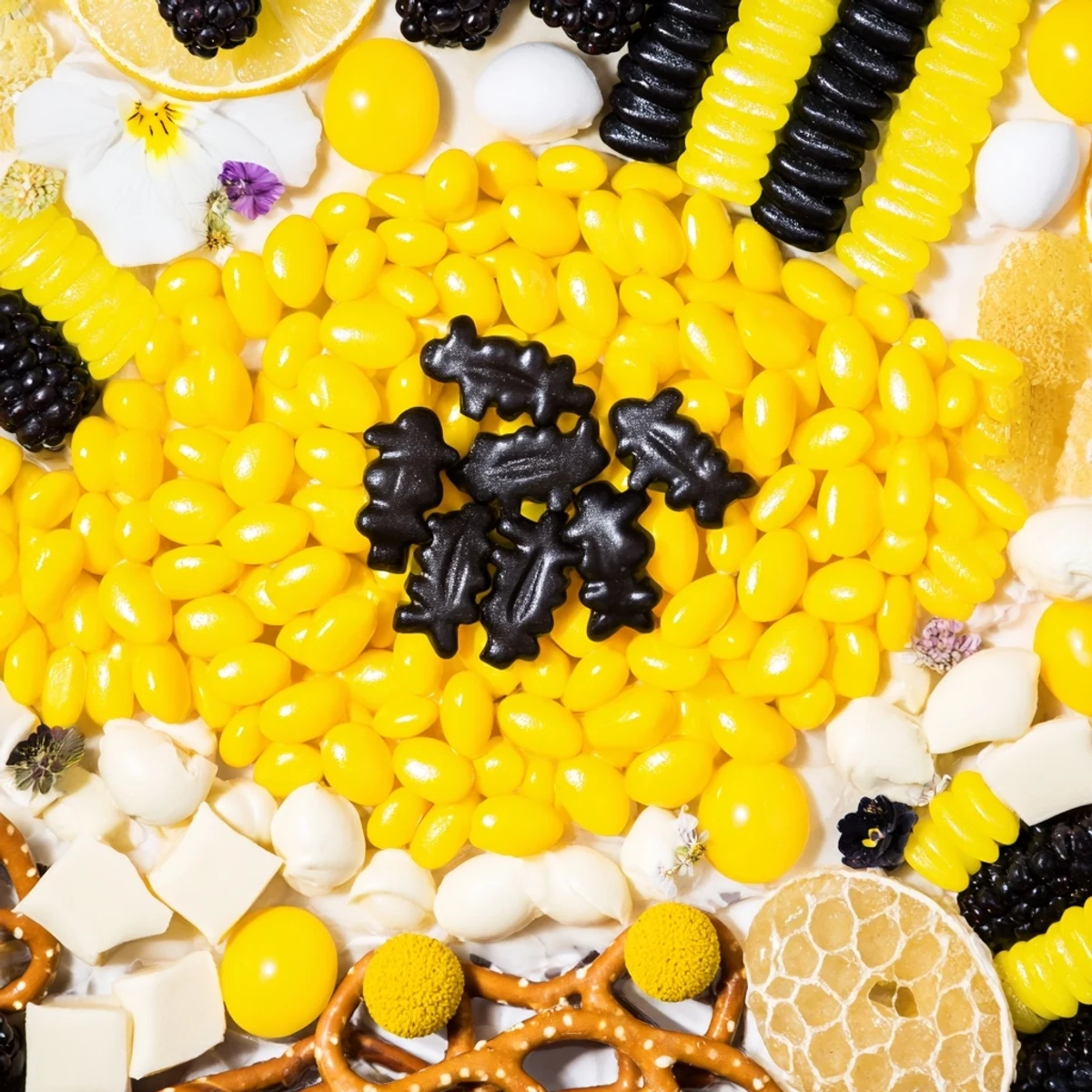 Vibrant and whimsical, this bumblebee candy board showcases a festive assortment for snacking.