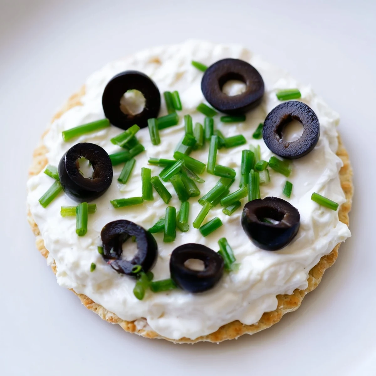 Colorful Gold Medal Olympic Ring Appetizers with vibrant toppings arranged on crackers for a party.