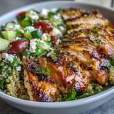 Freshly grilled chicken sits atop Lemon Herb Grilled Chicken Salad with quinoa.