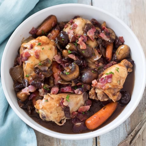 Tender Instant Pot Coq au Vin Style Chicken Thighs with rich red wine sauce and savory bacon.
