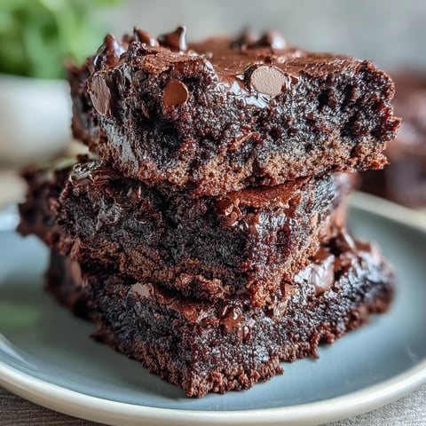 Freshly baked Greek Yogurt Brownies cooled on a wire rack, ready to be sliced into 12 squares.