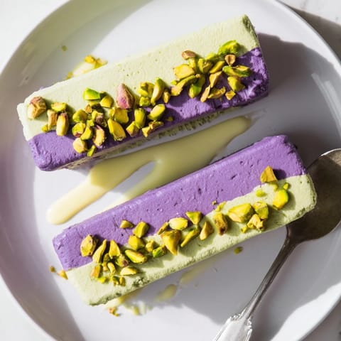 Delightful layers of ube and pistachio frozen treats, perfect for summer.  
