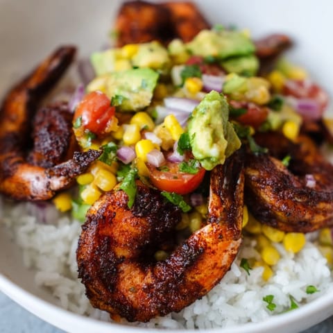 A colorful, close-up shot of a Blackened Shrimp Bowl, showing the vibrant Southwestern flavors.