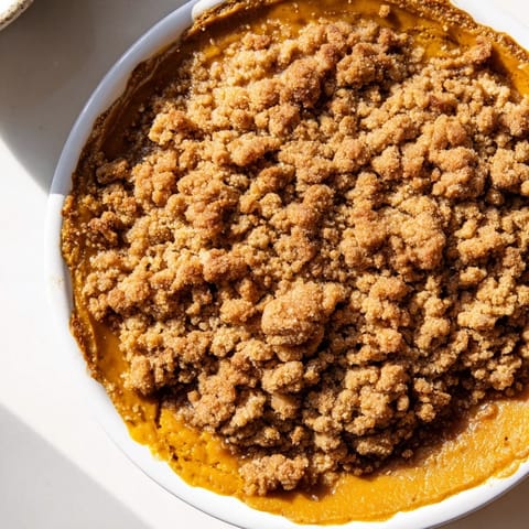 Buttery crumble topping covers spiced pumpkin in this easy, delicious pumpkin crisp recipe.