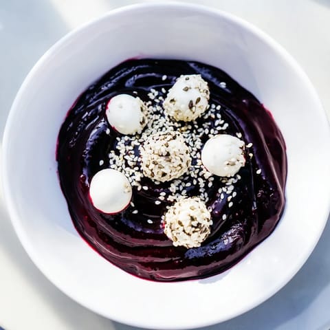 The Galaxy Spiral: A visually appealing dessert, featuring white goat cheese "stars" on swirled yogurt.