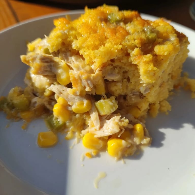 Savory Southern Cornbread Chicken Casserole with a crispy cornbread crust over tender chicken and corn filling.