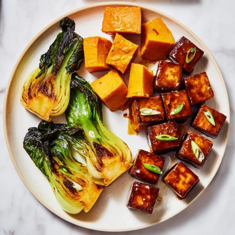 Savory miso glaze coats the caramelized tofu and squash, with fresh bok choy, a perfect plant-based meal.