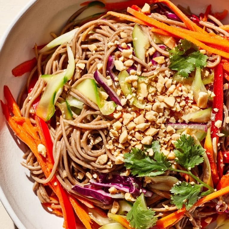 A close-up shot of refreshing Cold Noodle Salad with Sesame-Ginger Dressing, a perfect summer dish.